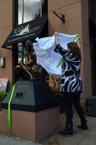 Cole unveiling one of the sculptures